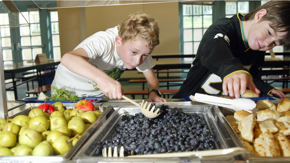 A small change in the environment (placing fruits at eye level) can lead to healthier behavior, such as eating fruits over other desserts
